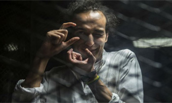 Photojournalist Shawkan turns 30 facing death behind bars in Egypt